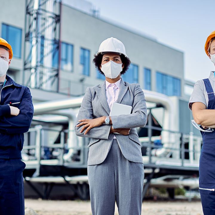 team-confident-civil-engineers-with-protective-face-masks-construction-site